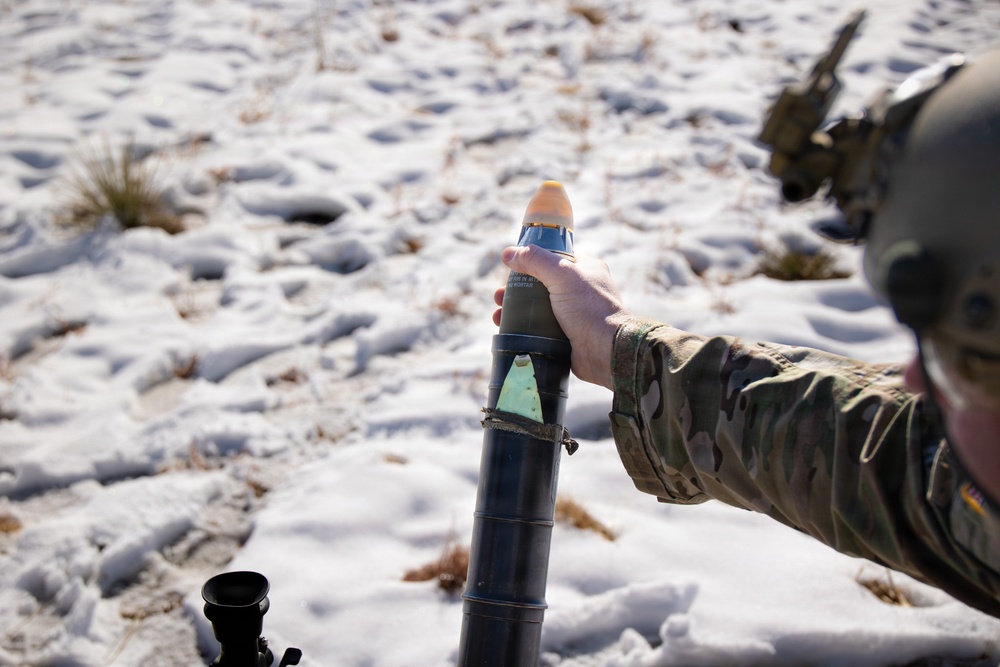 Special Forces Soldier hangs mortar round