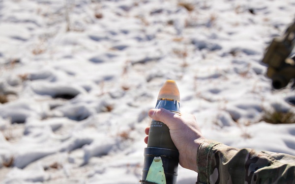Special Forces Soldier hangs mortar round