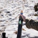 Special Forces Soldier hangs mortar round