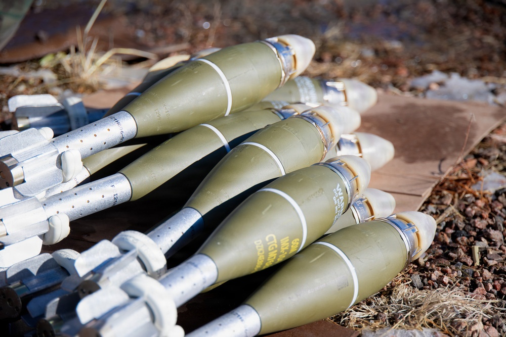 Mortar rounds lie staged for range