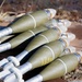 Mortar rounds lie staged for range