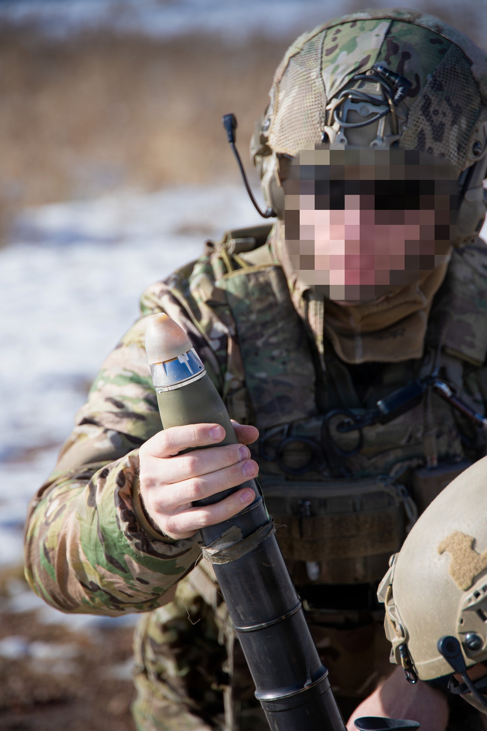 Special Operator hangs mortar round