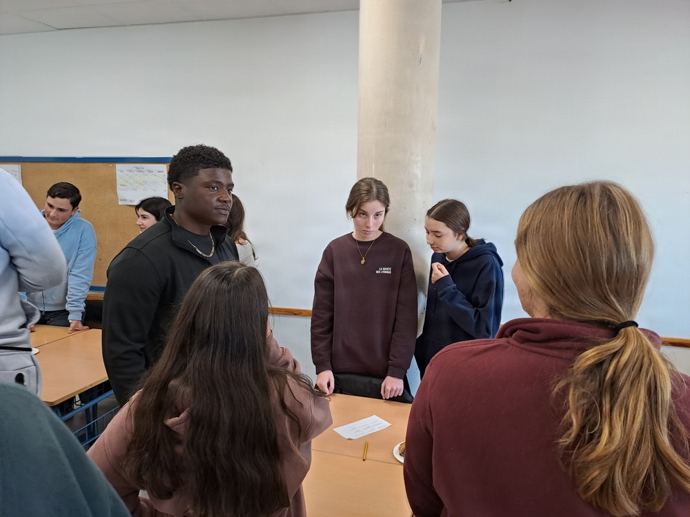 Sailors participate in language exchange event with local high school students