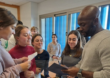 Sailors participate in language exchange event with local high school students