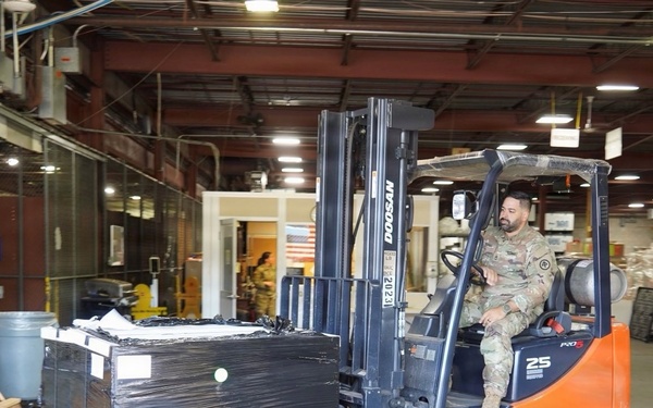 New Jersey National Guard Soldiers and Airmen load equipment bound for the Republic of Albania