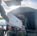 Members of the Albanian Armed Forces receive military equipment from the New Jersey National Guard