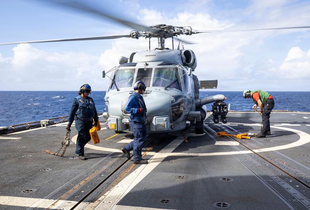 U.S Sailors Chock And Chain a Helicopter of USS Gettysburg (CG-64)