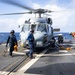 U.S Sailors Chock And Chain a Helicopter of USS Gettysburg (CG-64)