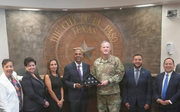 Maj. Gen. Curtis Taylor gives a American flag to the Mayor of El Paso