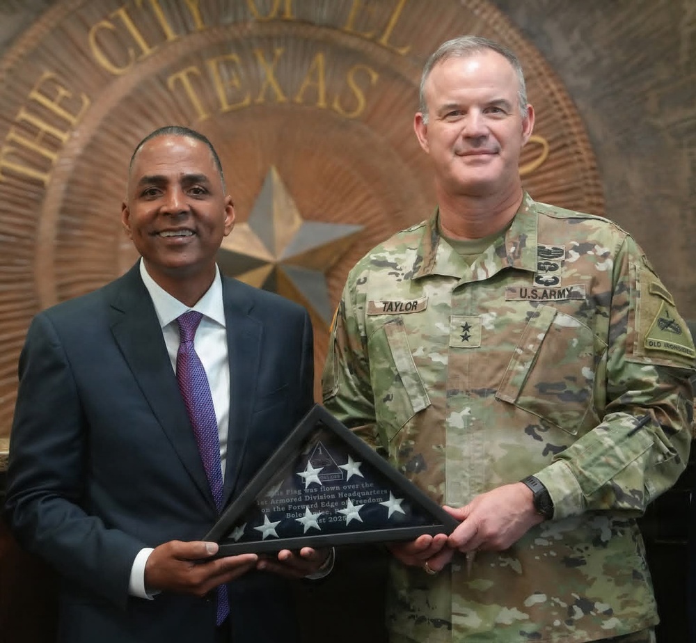 Maj. Gen. Curtis Taylor gives an American flag to Mayor of El Paso