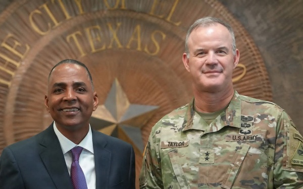 Maj. Gen. Curtis Taylor gives an American flag to Mayor of El Paso