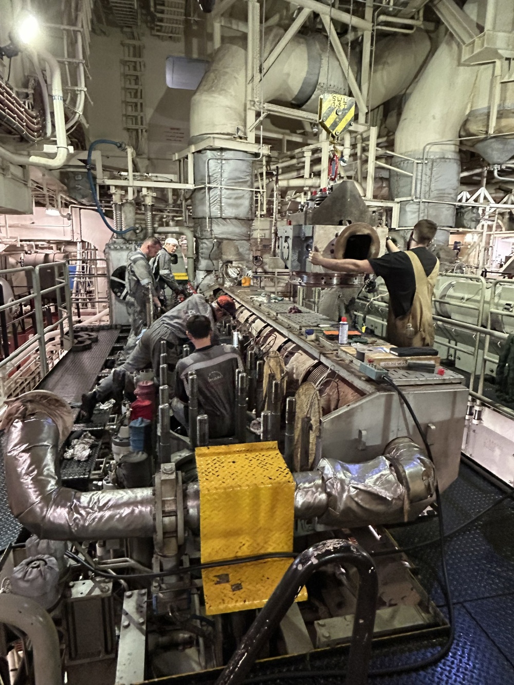 Engineers conduct engine overhaul on McLean while out to sea