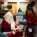 Santa spreads Toys for Tots cheer to students at Fred Ipalook Elementary School