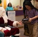 Santa spreads Toys for Tots cheer to students at Fred Ipalook Elementary School