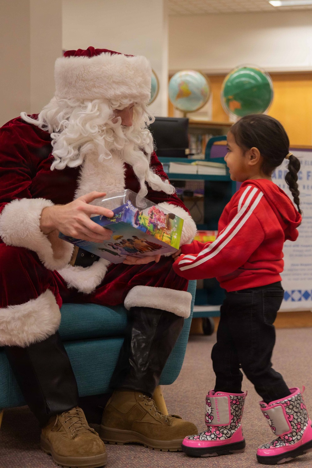 Santa spreads Toys for Tots cheer to students at Fred Ipalook Elementary School