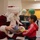 Santa spreads Toys for Tots cheer to students at Fred Ipalook Elementary School
