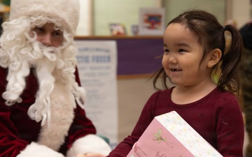 Isolated Cheer: U.S. Marines bring the Toys for Tots program to remote villages.