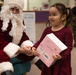 Santa spreads Toys for Tots cheer to students at Fred Ipalook Elementary School