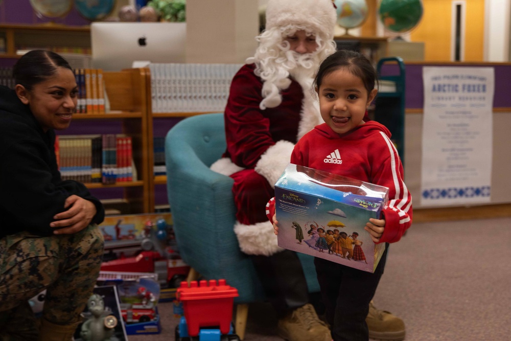 Santa spreads Toys for Tots cheer to students at Fred Ipalook Elementary School