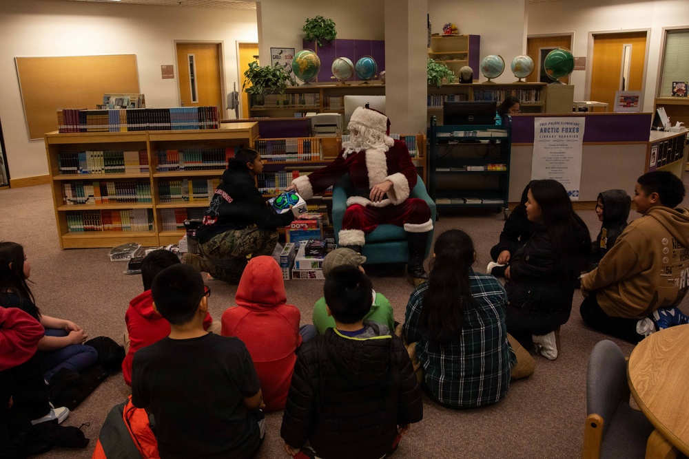 Santa spreads Toys for Tots cheer to students at Fred Ipalook Elementary School