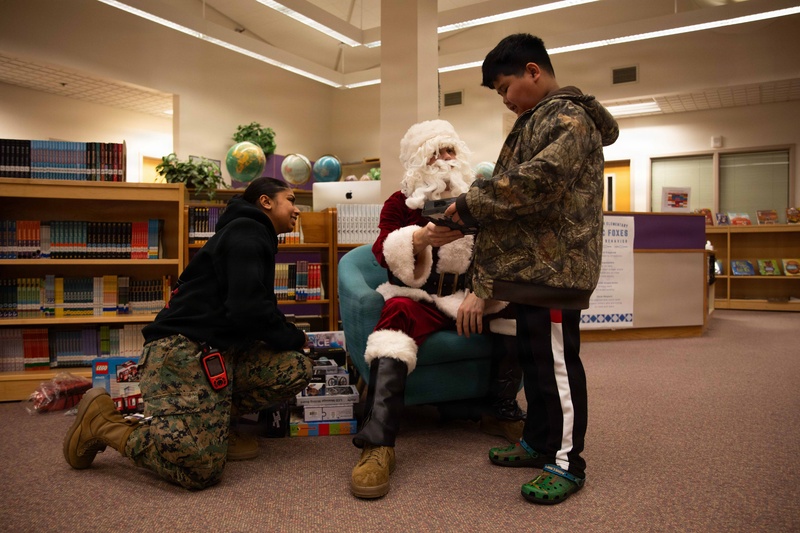 Santa spreads Toys for Tots cheer to students at Fred Ipalook Elementary School