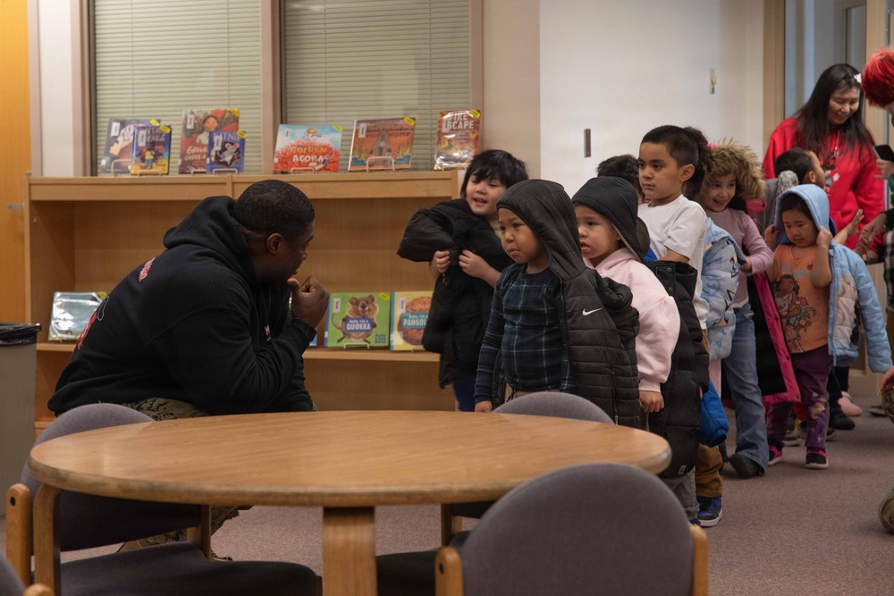 Santa spreads Toys for Tots cheer to students at Fred Ipalook Elementary School