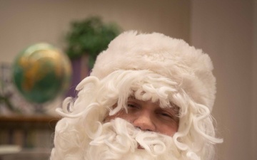 Santa spreads Toys for Tots cheer to students at Fred Ipalook Elementary School