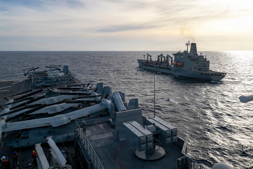 US Tripoli Conducts Replenishment-at-Sea with USNS Tippecanoe
