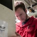Sailor Repairs Door Aboard USS Tripoli