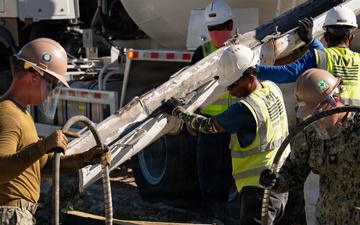 Seabees pour concrete for a Tension Fabric Structure construction project