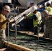 Seabees pour concrete for a Tension Fabric Structure construction project