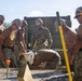 Seabees pour concrete for a Tension Fabric Structure construction project