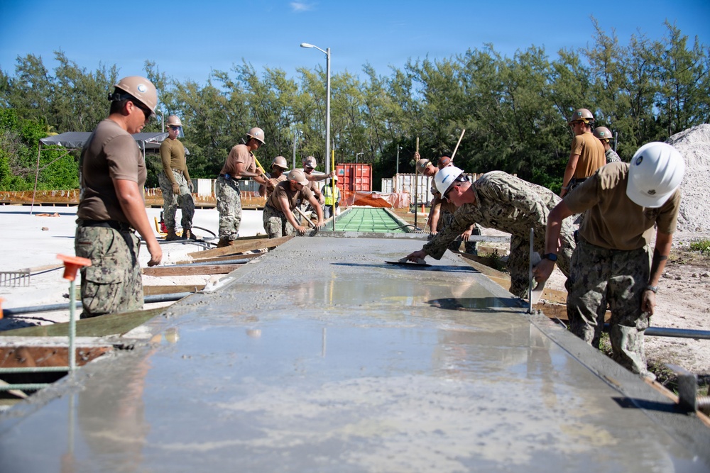 Seabees pour concrete for a Tension Fabric Structure construction project