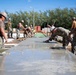 Seabees pour concrete for a Tension Fabric Structure construction project