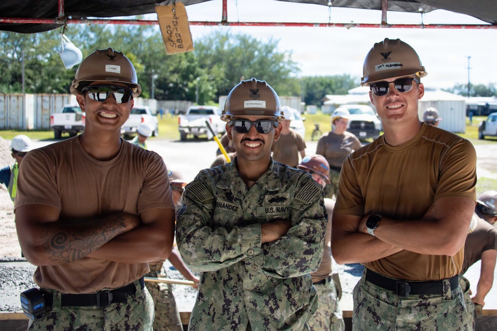 Seabees pour concrete for a Tension Fabric Structure construction project