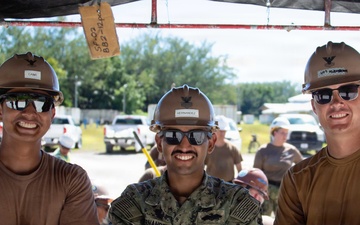 Seabees pour concrete for a Tension Fabric Structure construction project