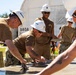 Seabees pour concrete for a Tension Fabric Structure construction project