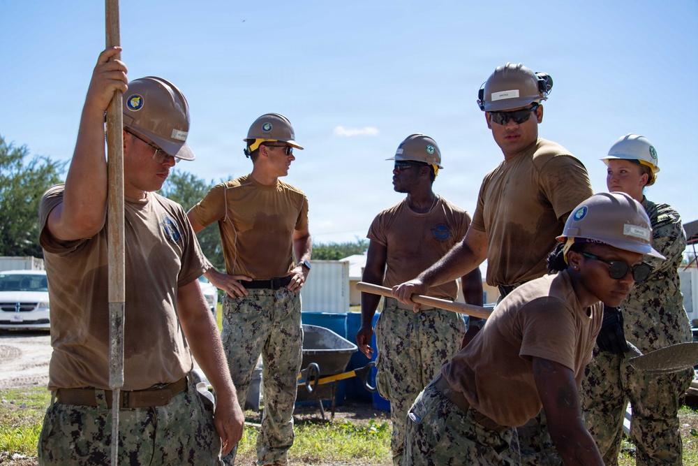 Seabees pour concrete for a Tension Fabric Structure construction project