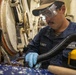 USS Mitscher (DDG 57) Sailor conducts scuttle maintenance