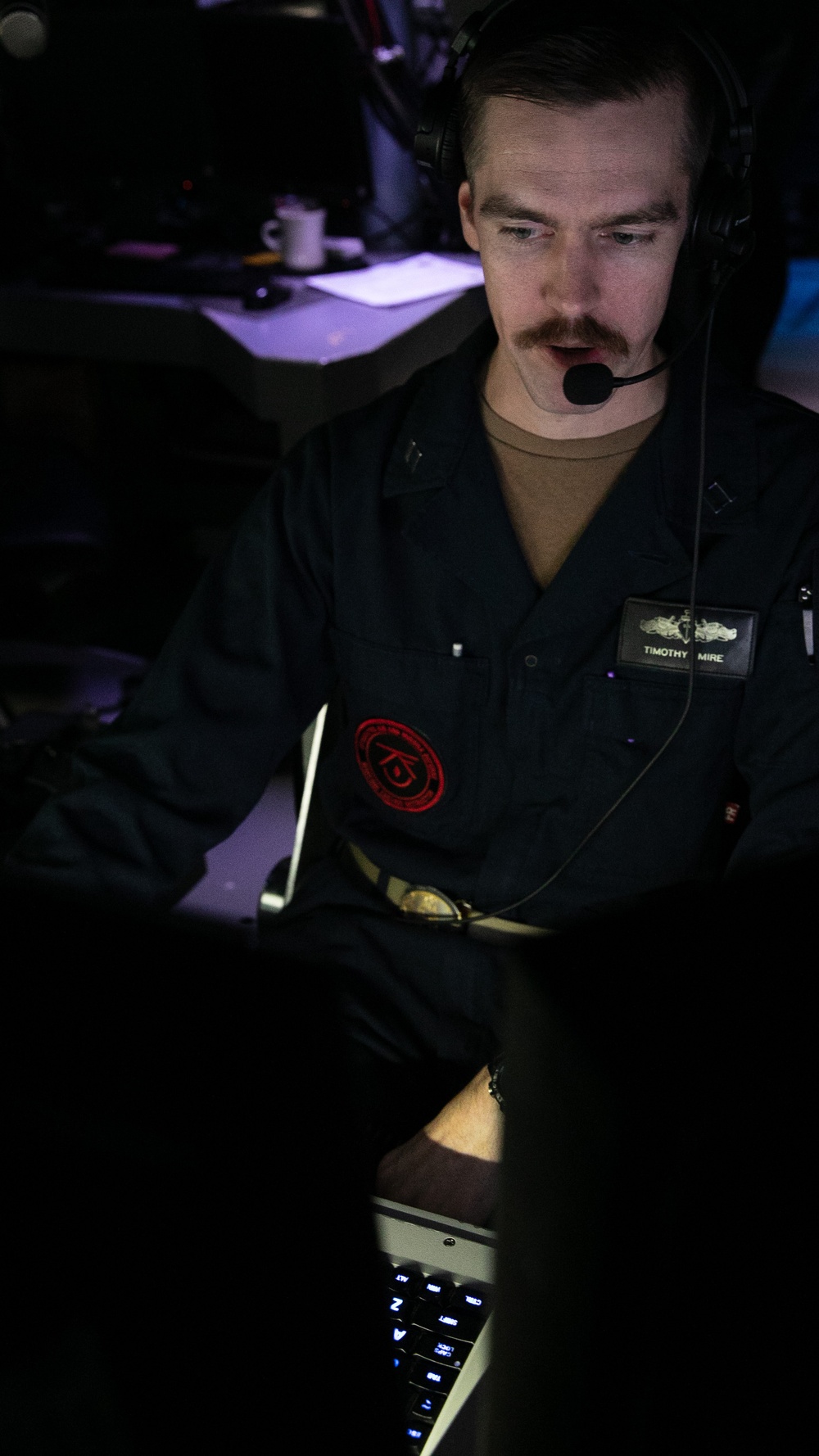 USS Mitscher (DDG 57) stands tactical action officer watch in ship combat direction center