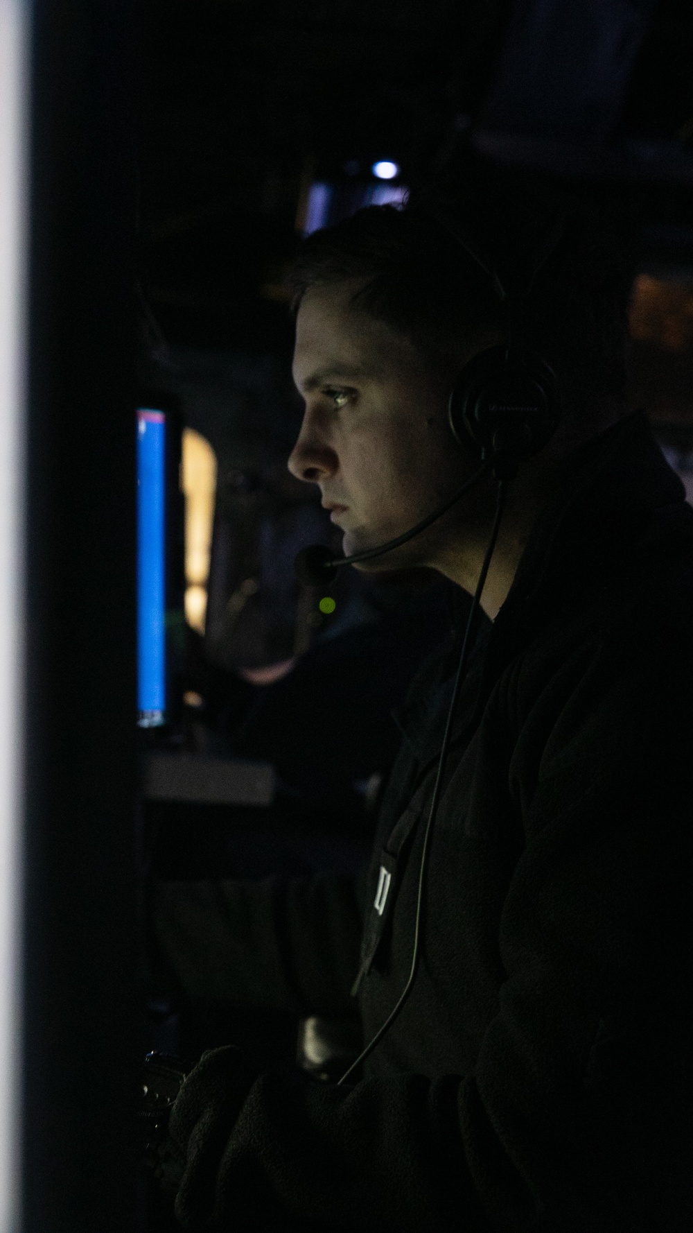 USS Mitscher (DDG 57) Officer stands watch in ship combat direction center