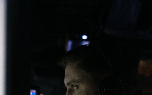 USS Mitscher (DDG 57) Officer stands watch in ship combat direction center