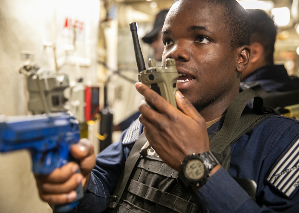 USS Mitscher (DDG 57) Sailor relays information on radio during ATTT drill