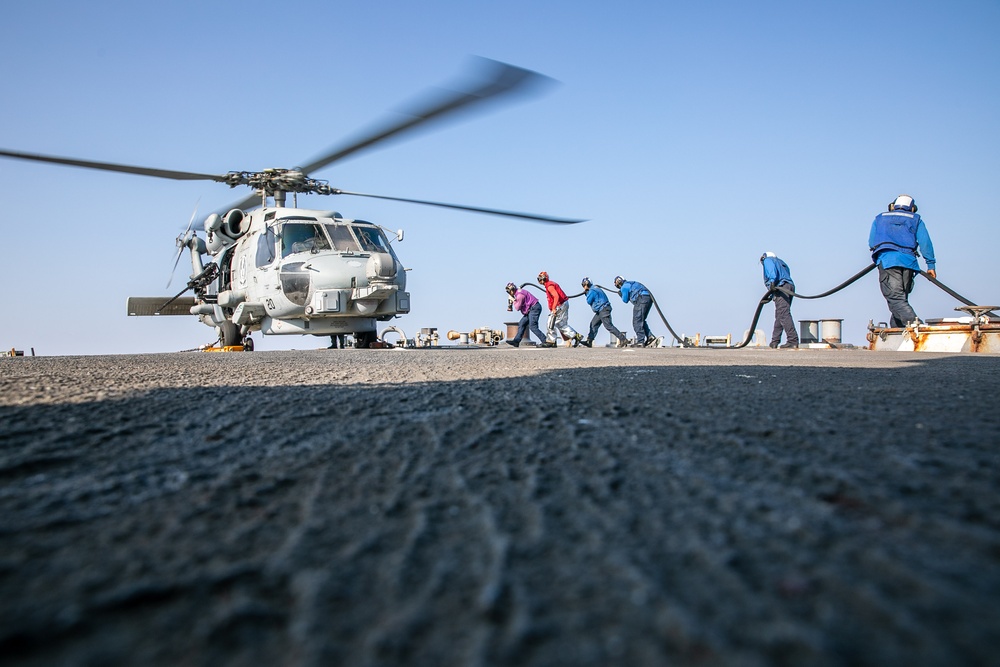 USS Mitscher (DDG 57) Sailors conduct refueling operation with HSM 79 Sea Hawk