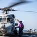 USS Mitscher (DDG 57) presents fuel sample to HSM 79 Sea Hawk during flight quarters