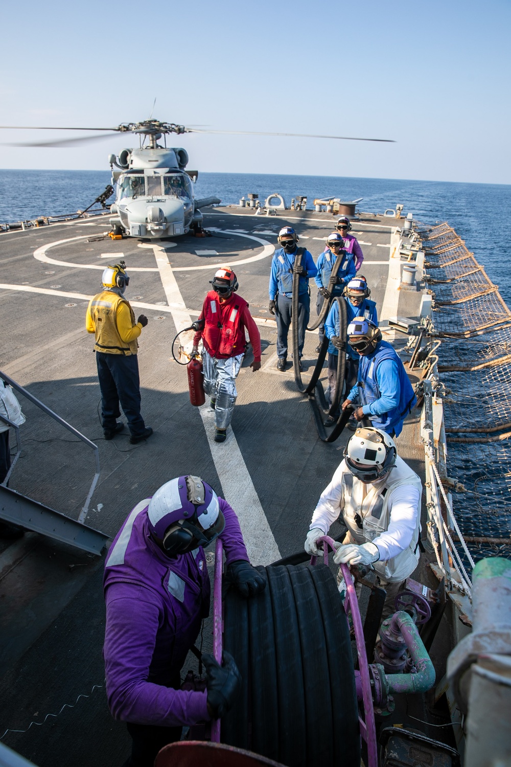 USS Mitscher (DDG 57) Sailors conduct refueling operations with HSM 79 Sea Hawk