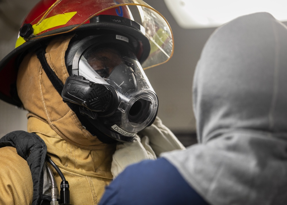USS Mitscher (DDG 57) Sailors conduct general quarters drill