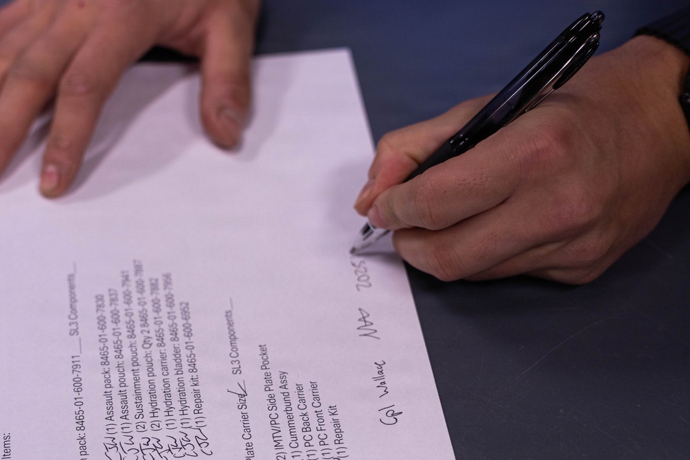 Reserve Marines with 25th Marine Regiment receive gear at Fort Devens