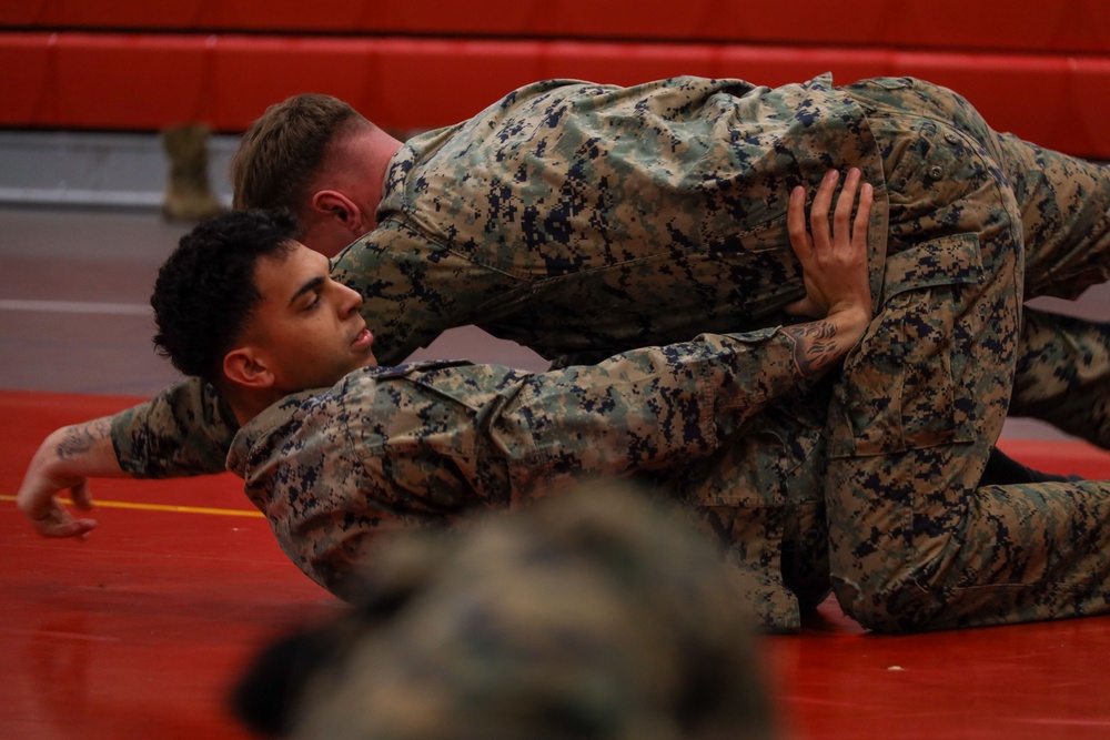 MBW Corporal's Course 1-26 participates in groundfighting PT