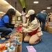 Volunteers spread holiday cheer to Fort Lee AIT Soldiers with 400 gift bags